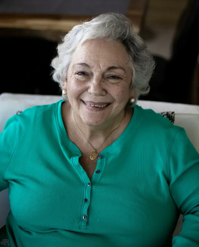 a woman smiling for the camera